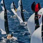 A dense fleet of Cape 31 one-design yachts racing under spinnaker, sails marked C31, including boats from Germany, Italy, Great Britain and Türkiye