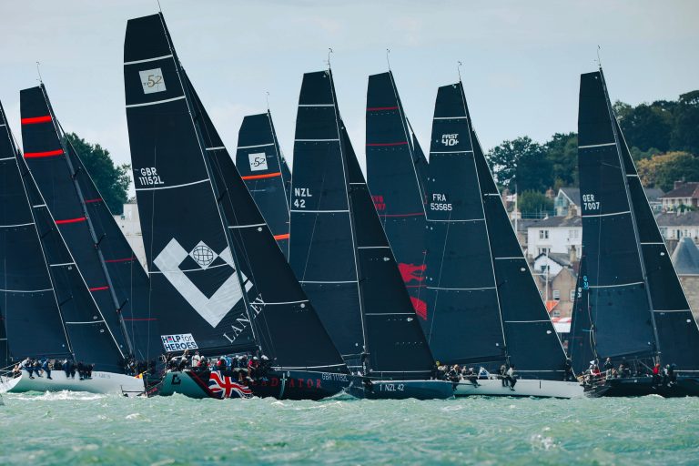 TP52s and other IRC Class Zero yachts crossing the start line together for the Britannia Cup at North Sails Cowes Week